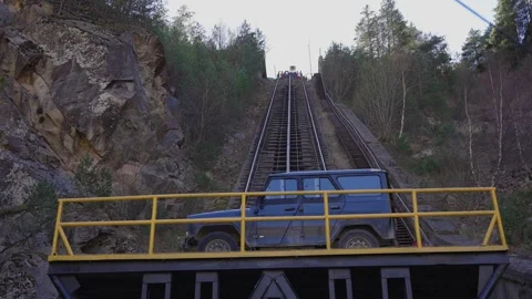 Funicular car lifting up the mountain track Stock Footage 310230213
