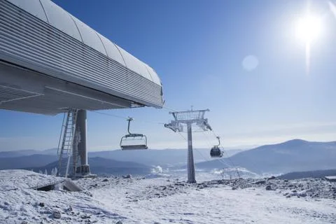 Funicular goes up. Cable car going on top of the hill. Skiing and snowboardin Stock Photos