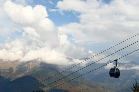 Funicular in the high mountain and sky with clouds. Beautiful landscape Stock Photos