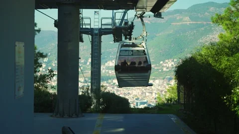 Funicular in the mountains on the background of the city Stock Footage 239545901