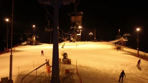 Funicular at night and track with many skiers in ski resort Video stock 63030260