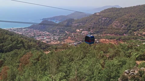 Funicular, teleferik, Cable car blue transparent cabins move along Stock Footage 162108907