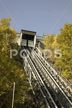 Funicular tracks and sign against blue skies Stock Photos