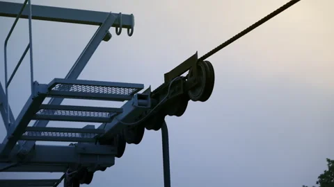 Funicular wheels close-up against the background of a blue cloudy sky. Detail of Stock Footage 279852523