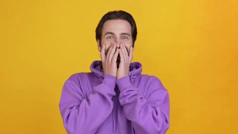 Funky guy hear message shout hands cover face isolated shine color background Stock Footage 165862034