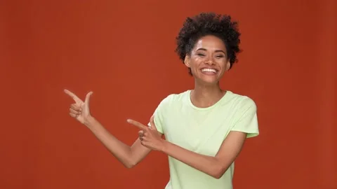 Funky lady point empty space ads isolated cherry crimson color background Stock Footage 166542101