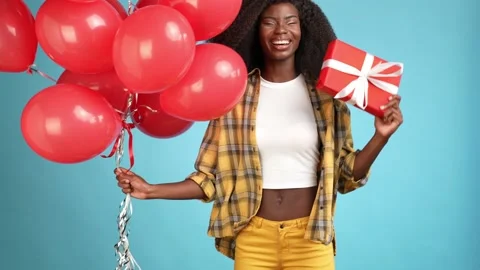 Funky lady red balloons gift bargain event isolated blue color background Stock Footage 166158371
