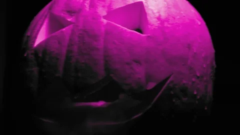 Funky Neon flashing Jack o lantern pumpkin. Halloween. Stock Footage 119213967