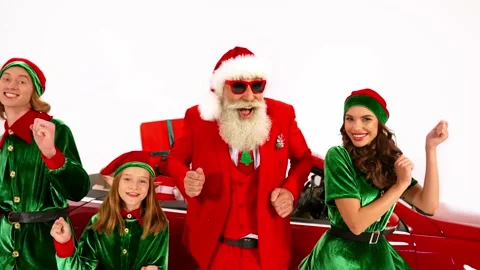Funky santa workshop helpers have fun dance hold hands celebrate x-mas event Stock Footage 161257302