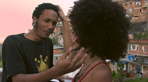 A funky young couple talking to each other on terrace Stock Footage 61292253