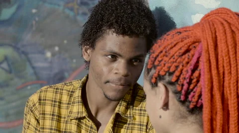 A funky young couple talking to each other near wall Video stock 61292309