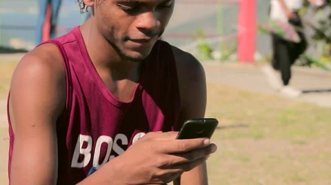 Funky young man checking his Mobile phone Stock Footage 61273743