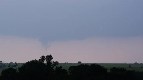 Funnel cloud attempting to form out of wall cloud base over farmland, time lapse Stock Footage 59525413