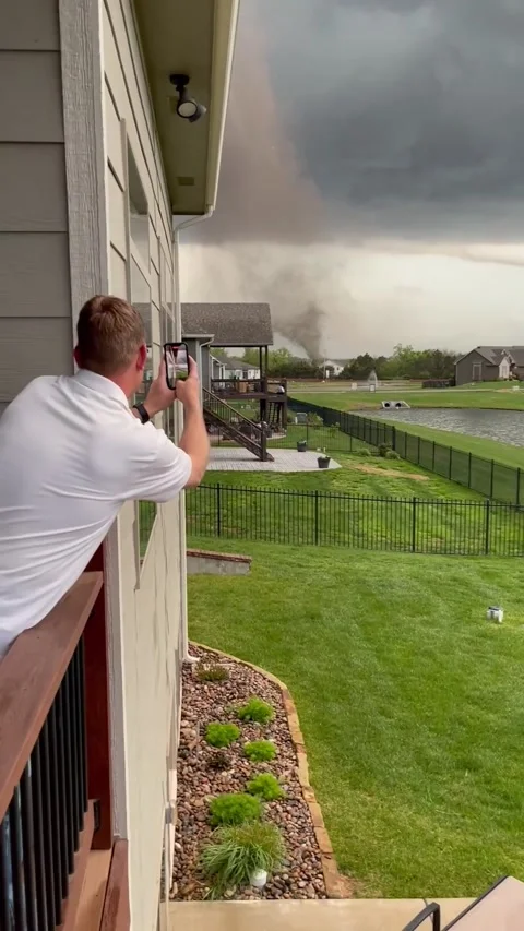 Funnel Cloud Floats Over Kansas Community, Wichita, Kansas, USA - 19 May 2022 Video stock 205426848