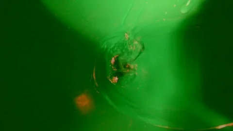 Funnel for pouring water into a container with a smaller hole in the throat Stock-Footage 87572096
