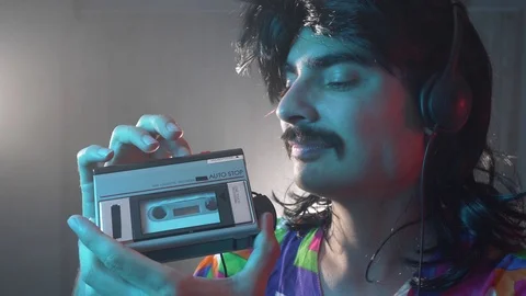 Funny 80s man Using Portable Cassette Tape Player Stock Footage 114251062