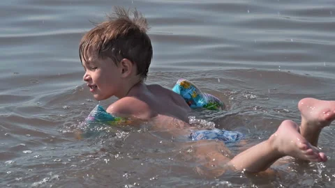 Funny active child bathing in salty lake Video stock 89825663
