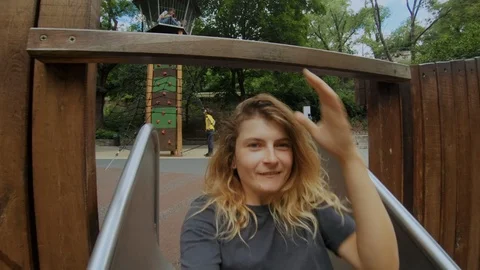 Funny adventures on playground slide Video stock 97359092
