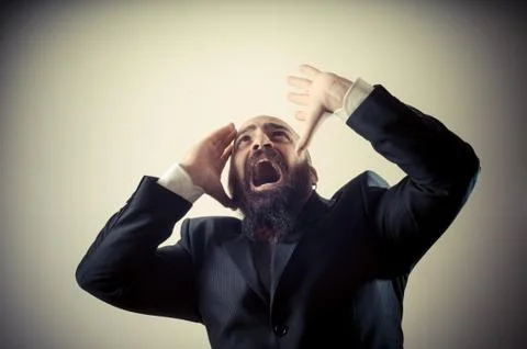 Funny afraid elegant bearded man Stock Photos