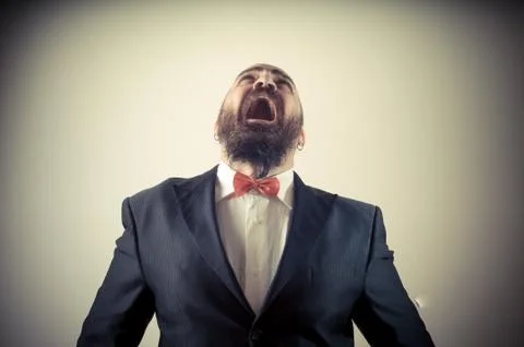 Funny afraid elegant bearded man Stock Photos