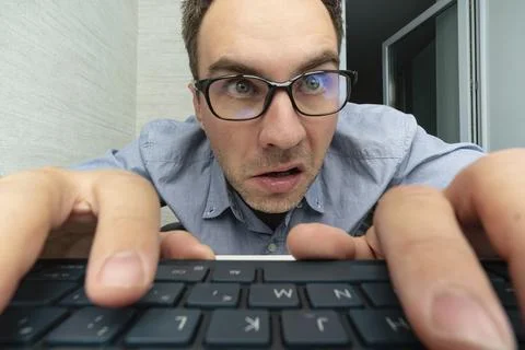 Funny and crazy man using a computer on white background. man's hands on th.. Stock Photos