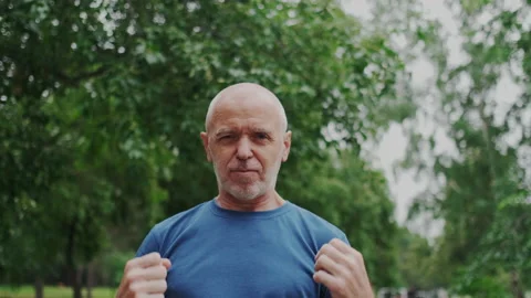 Funny and Happy Eldery Man Showing Ready to Fight. He Showing Power, Healthy Stock Footage 148465023