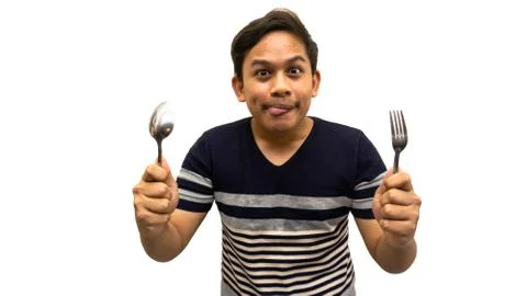 Funny and hungry face expression of young Asian Malay man Stock Photos