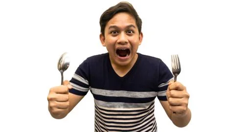 Funny and hungry face expression of young Asian Malay man Stock Photos