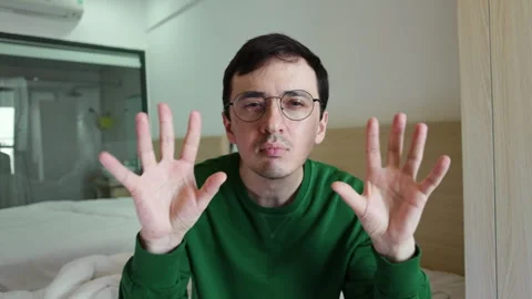Funny and slightly crazy man dancing and making goofy hand gestures Stock Footage 337366314