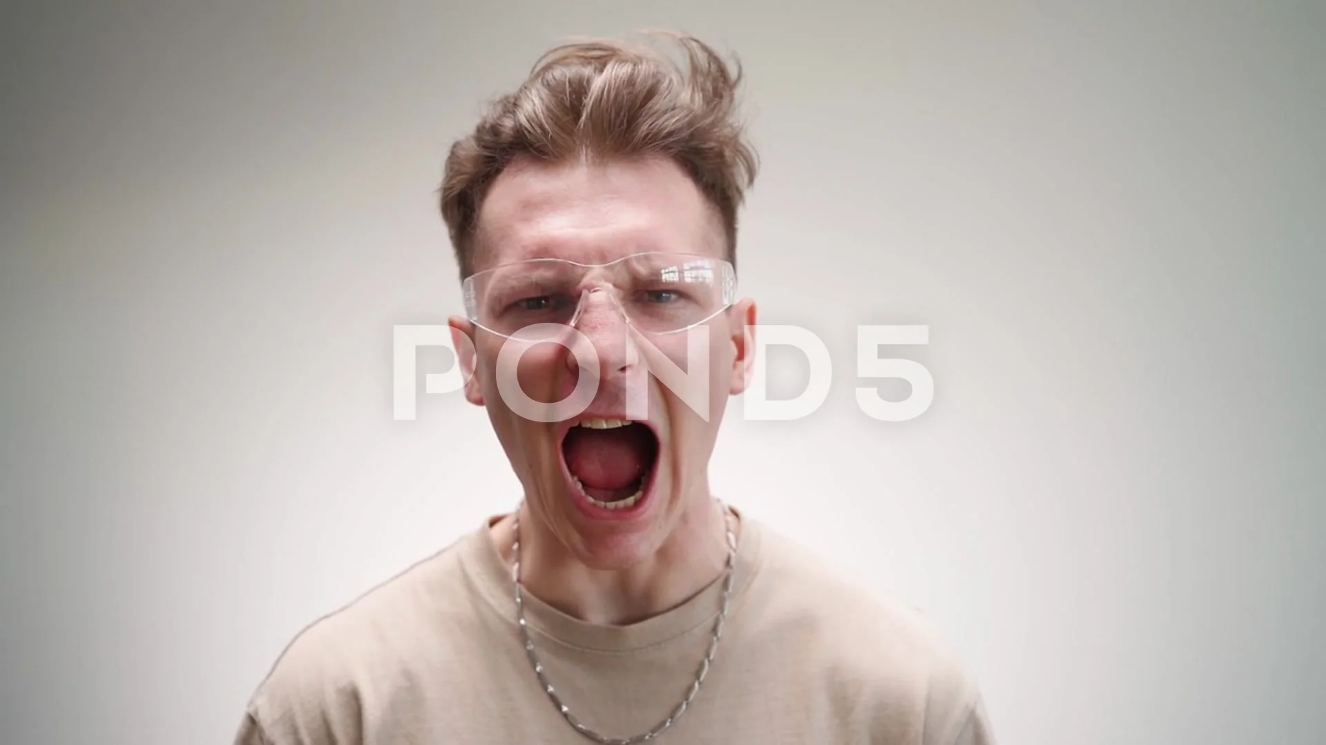 Funny Angry Man in Glasses Looks at the ... | Stock Video | Pond5