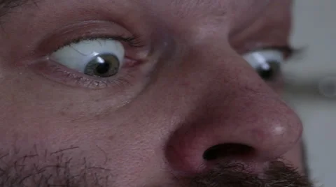 Funny anxious paranoid over caffeinated man with darting popping eyes Stock Footage 44501894