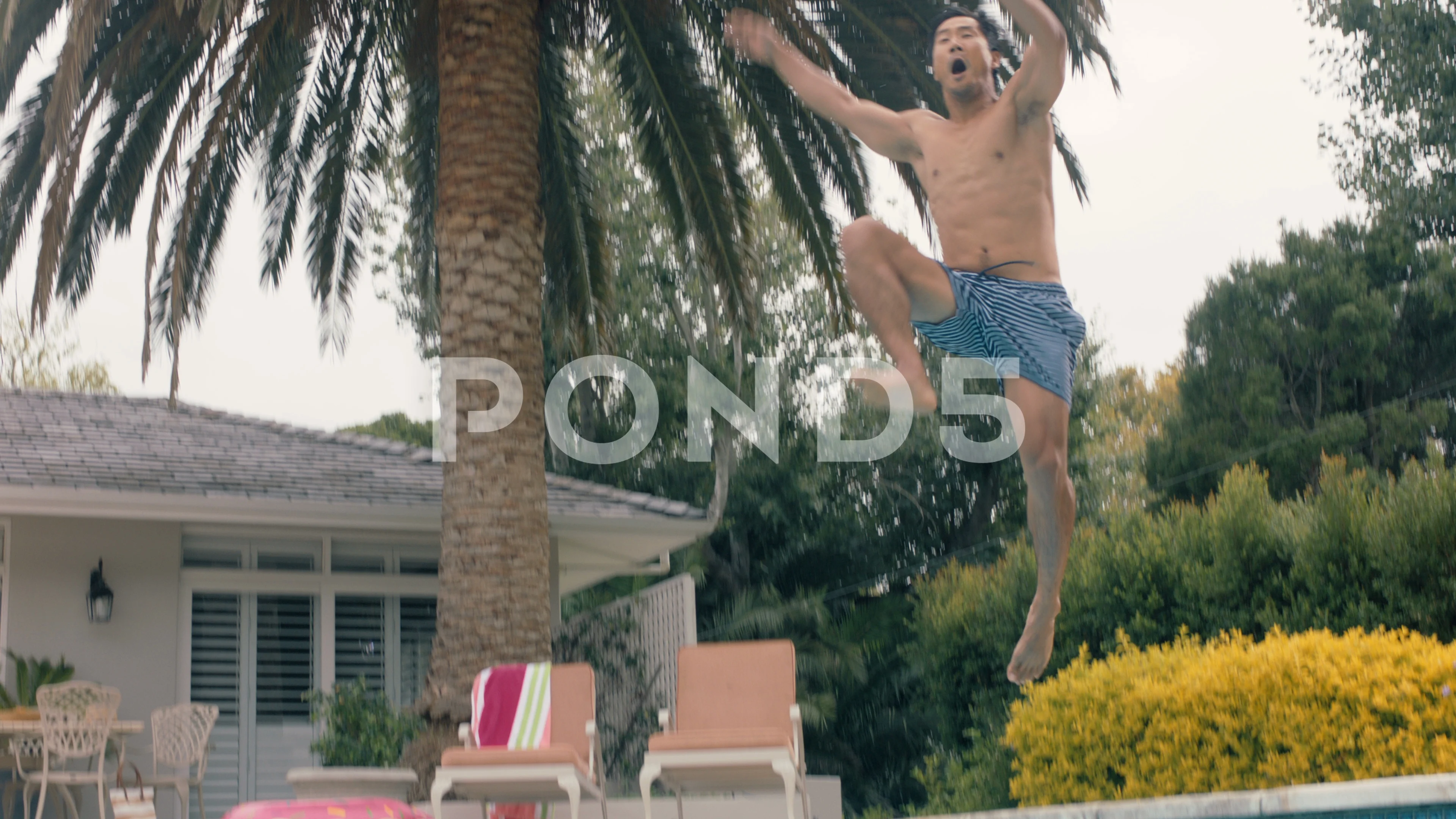 funny asian man jumping in swimming pool... | Stock Video | Pond5