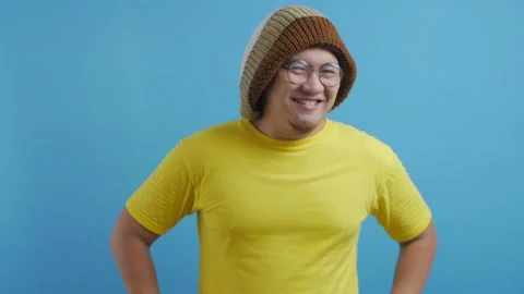 Funny Asian man smiling at camera. Confident good looking positive person Stock Footage 141610535