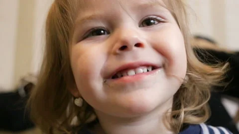 Funny baby looking at the camera. Closeup, bottom-up view, real time, indoors, i Stock Footage 88282197
