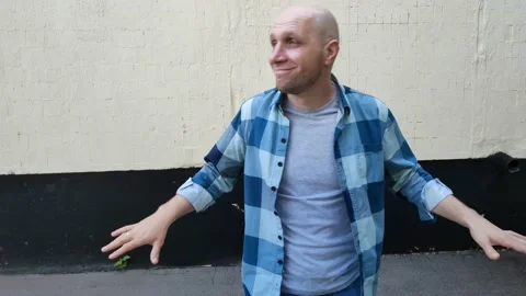 Funny bald guy dancing on street near building Stock Footage 202610437