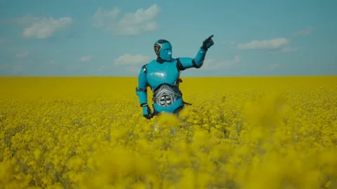Funny blue cyborg programmed to dance having fun dancing on beautiful yellow Stock-Footage 133295890