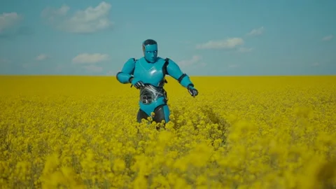 Funny blue robot android cyborg dancing with cool moves among flowers on large Stock Footage 133295480