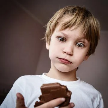 Funny boy with chocolate Photos