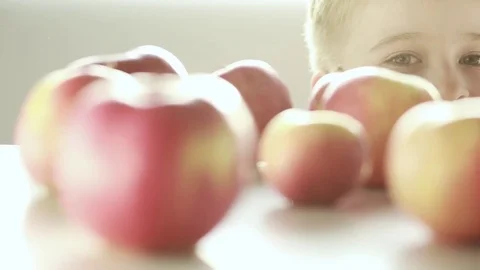  The funny boy crawls out from under the table. Stock Footage 81784527