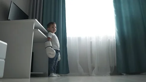 Funny boy drops his Boxing gloves. Stock Footage 130837991