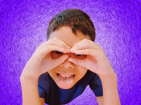 Funny Boy Gesturing Hand and Fingers Over Eyes Isolated on Violet Background Stock Photos