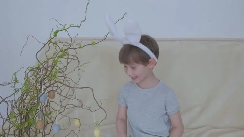 Funny boy in rabbit ears on his head. Easter child Stock Footage 149755841