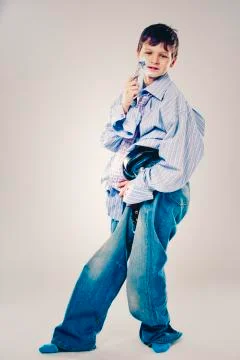 Funny boy wearing Dad's clothes Stock Photos