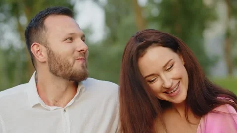 Funny boyfriend eats grape when girlfriend puts it into mouth at romantic date Stock Footage 255679079