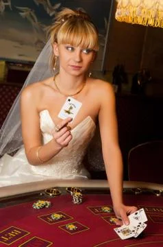 Funny bride playing cards Stock Photos