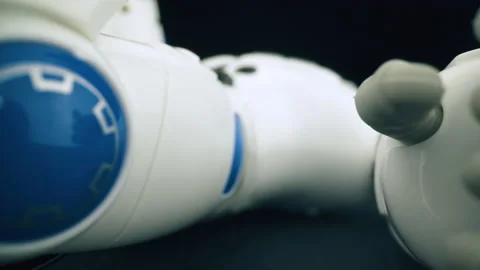 Funny broken robot with decorative elements in dark room Stock Footage 161508139