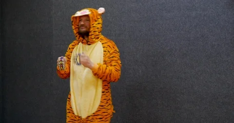 Funny business worker in open space wearing kigurumi, tiger pajama Stock Footage 106080553