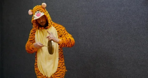 Funny business worker in open space wearing kigurumi, tiger pajama clothing Stock Footage 106090747