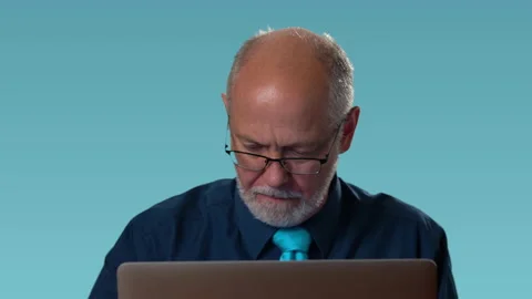 Funny businessman at computer feels rage and anger furious at his computer and Video stock 138400690