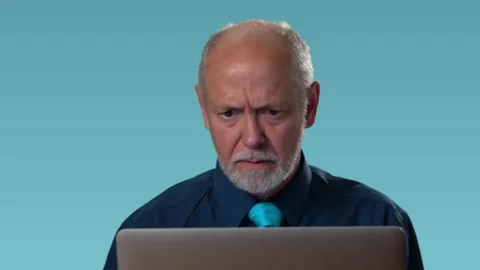 Funny businessman at computer feels rage anger furious at his computer and yells Video stock 138400832